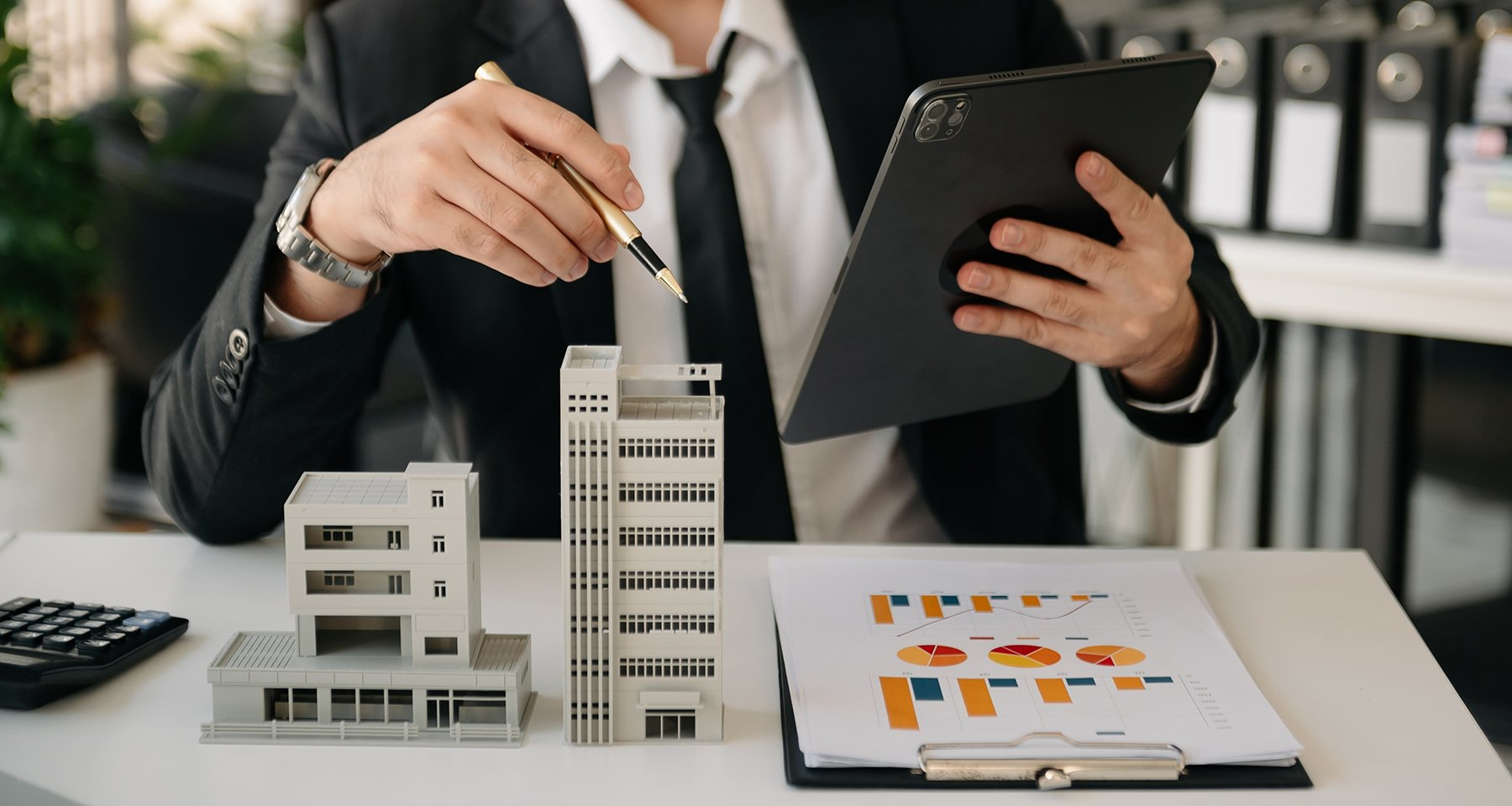 Property professional reviewing housing information