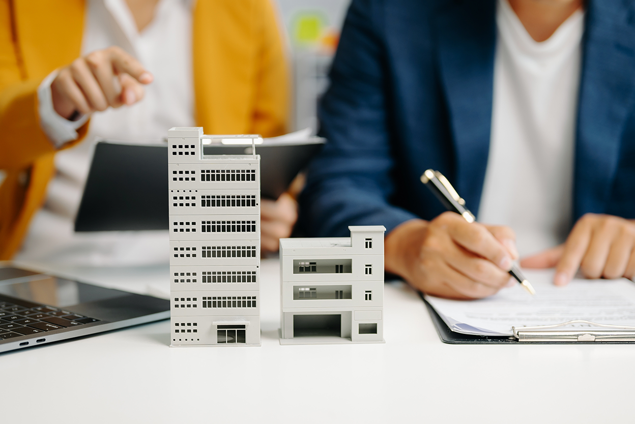 Rental housing professionals working with model buildings