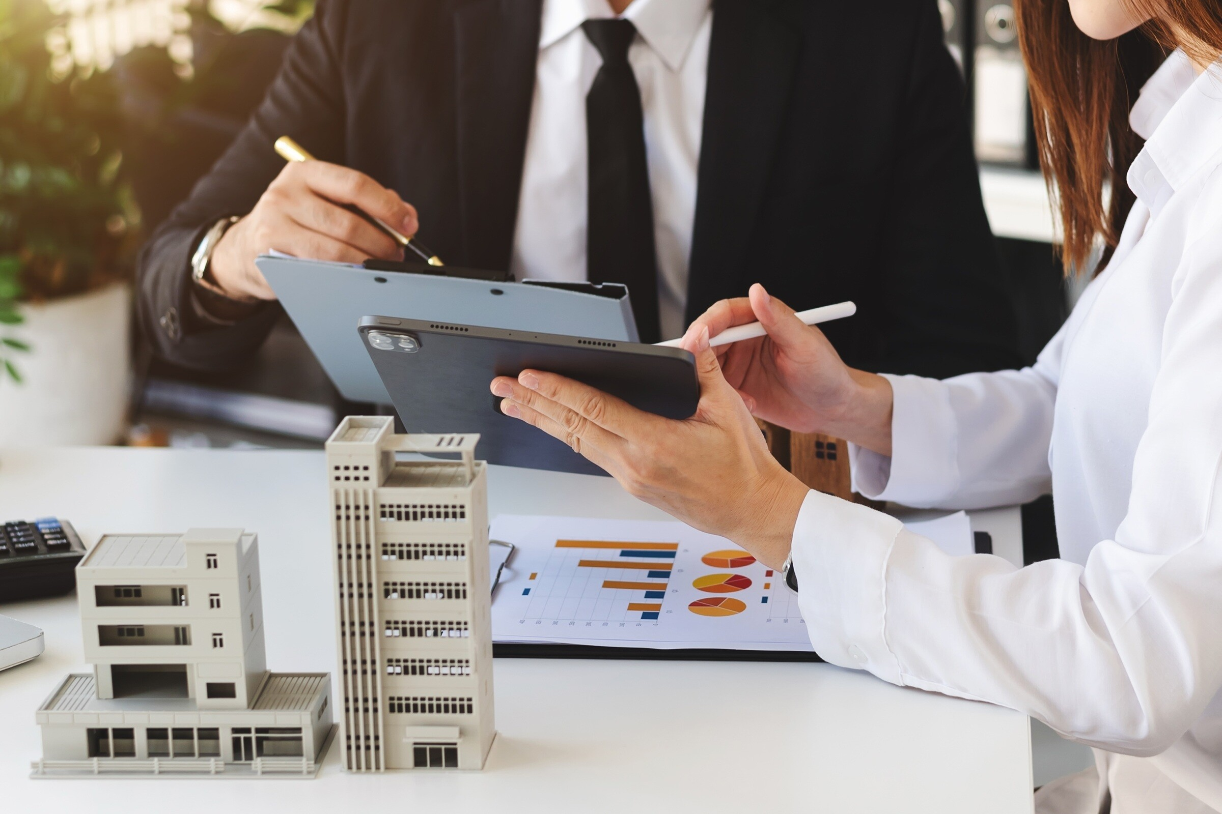 Housing professionals reviewing property information